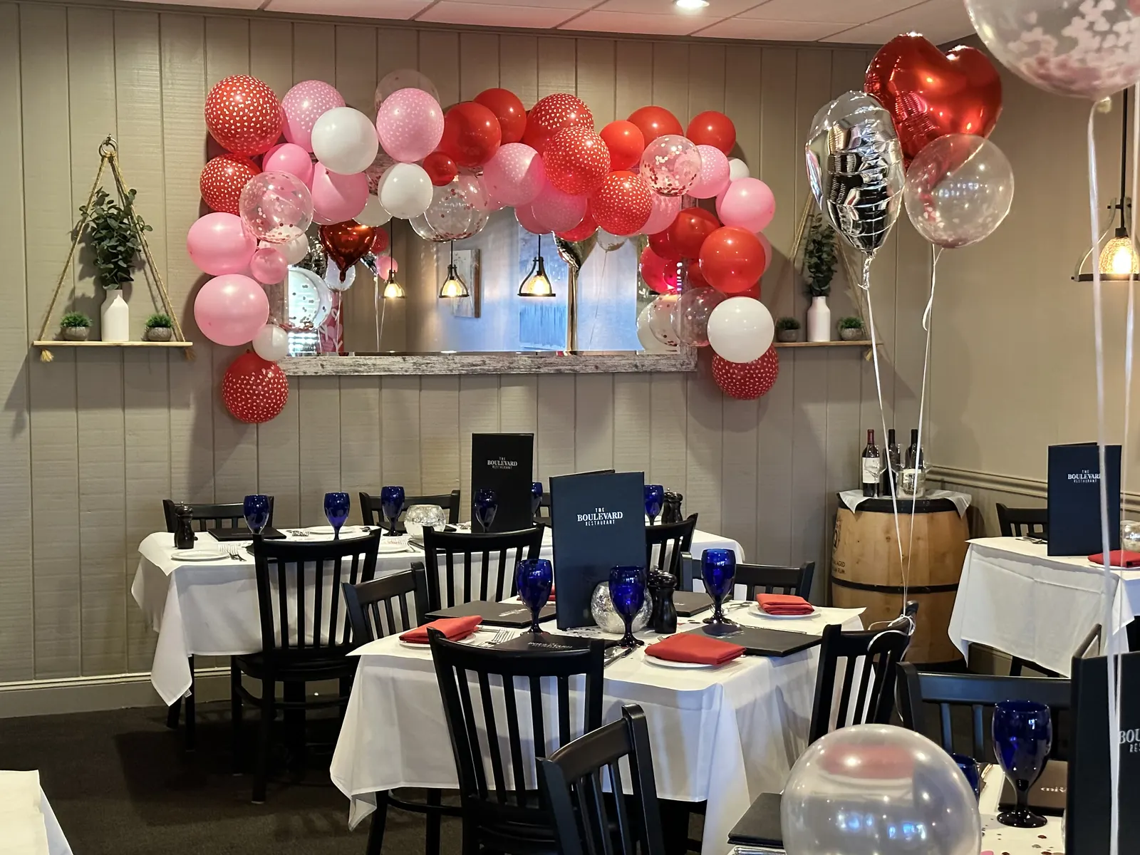 The dining room decorated with red and pink balloons