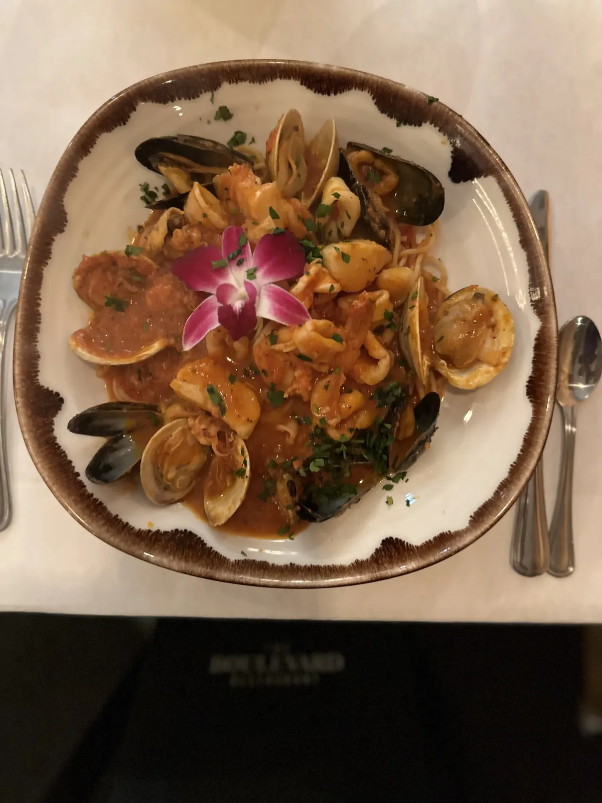 Seafood with clams and mussels in red sauce over pasta